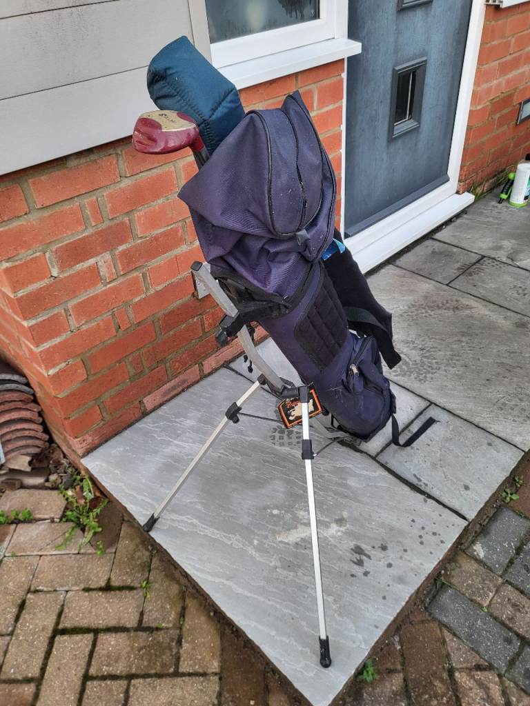 Golf bag with his and hers 3 woods 