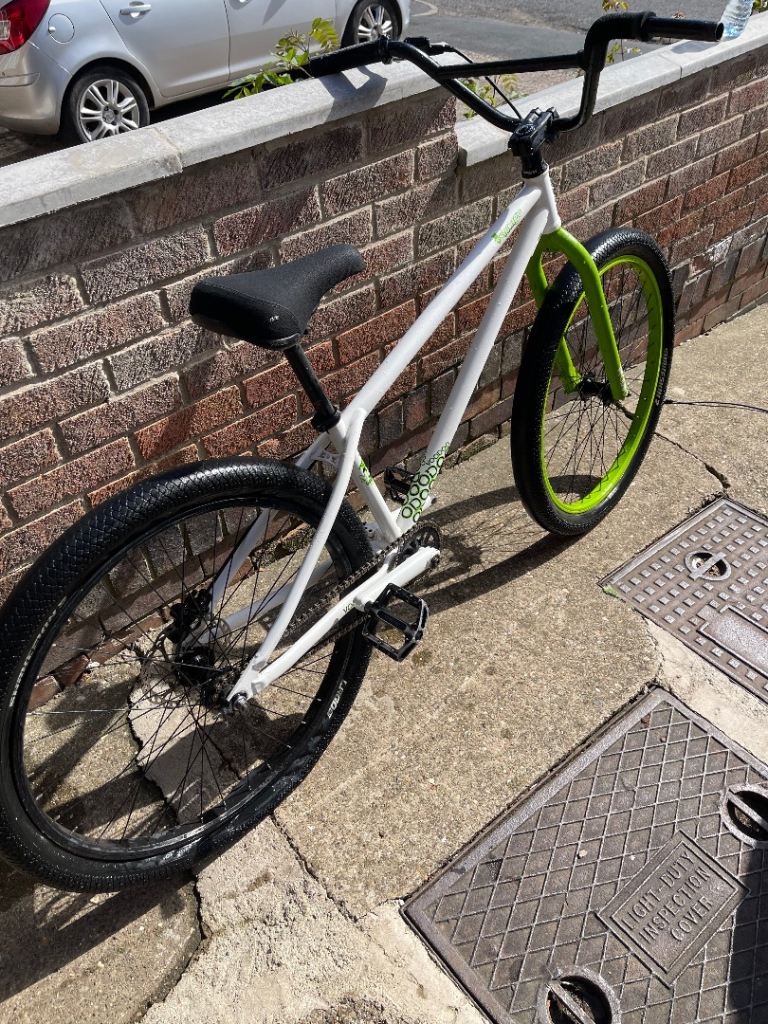 A white and green BMX bike