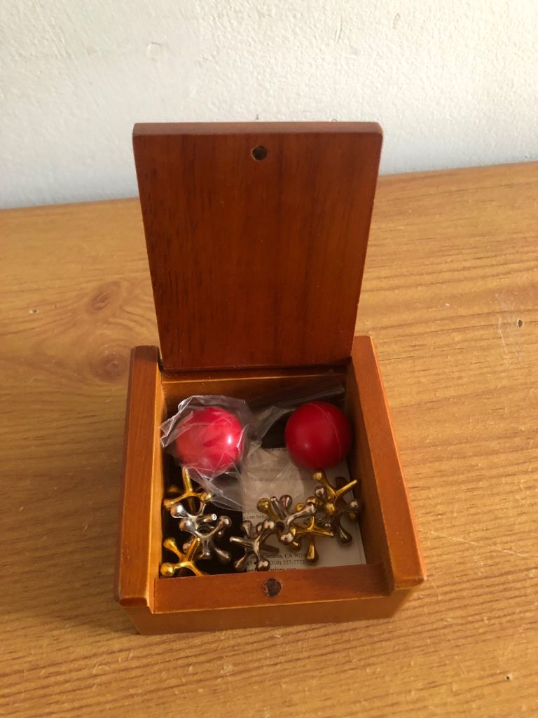 JACKS in wooden box