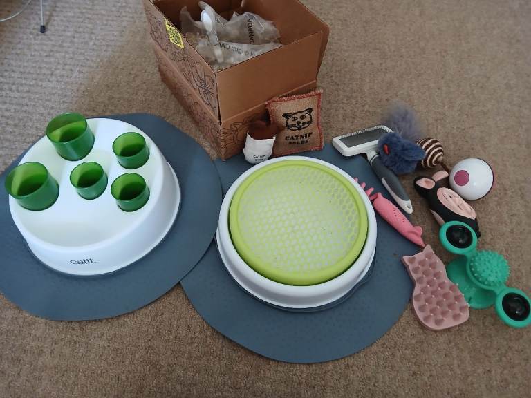 Cat toys including catit feeder, catit grass growing kit and robotic ball