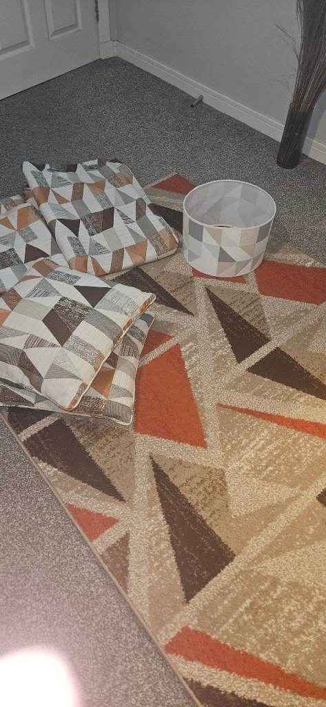 Curtains , rug ,cushions and light shade