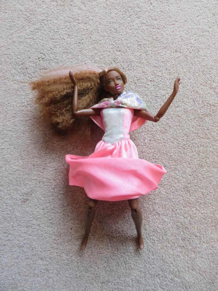 Genuine Barbie doll in a Genuine Dress articulated arms and legs and lovely hair
