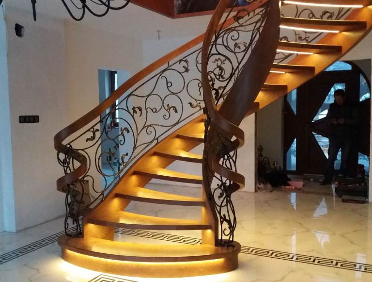 Curved oak staircase with iron balustrade stairs from Poland