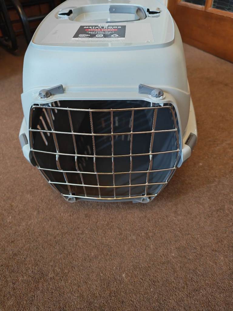 New pet carrier, metal door, extra small. 