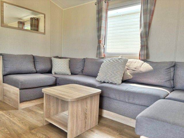 FOUR BEDROOM STATIC CARAVAN FOR SALE AT BROADLAND SANDS HOLIDAY PARK - 11.5 MONTH OWNER SEASON