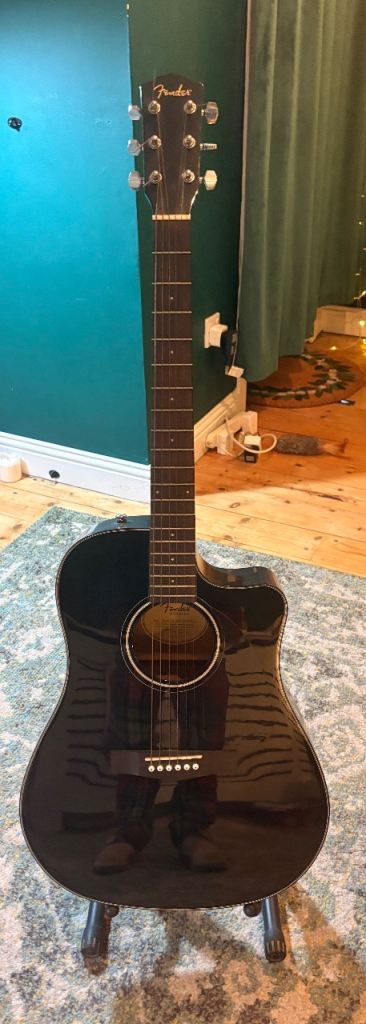 Fender acoustic guitar with stand, carry bag and tuner