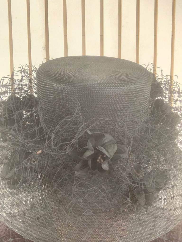 Graham Smith floral fascinator with a wide brim.