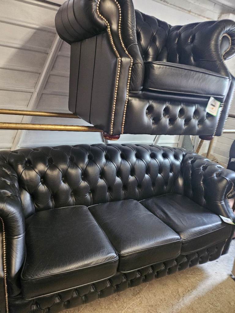 As new black real Chesterfield sofa & club chair 
