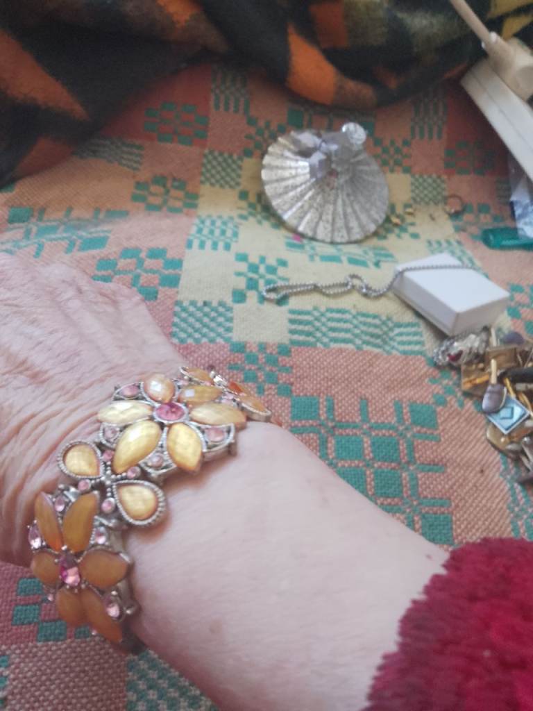 Nice silver coloured bracelet with yellow stone and pink crystals 