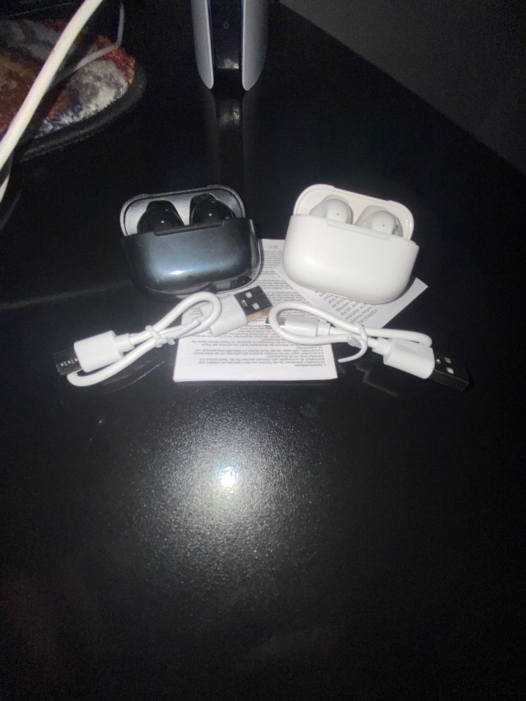 Pair of Wireless Earbuds with Charging Cases – Black & White