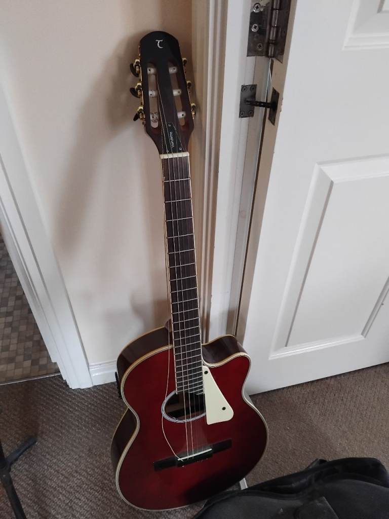 Acoustic guitar, stand and case 