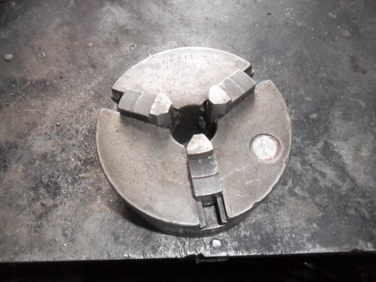 lathe chuck 3 jaw 4 1/2  no back plate unknown make bit rough but works