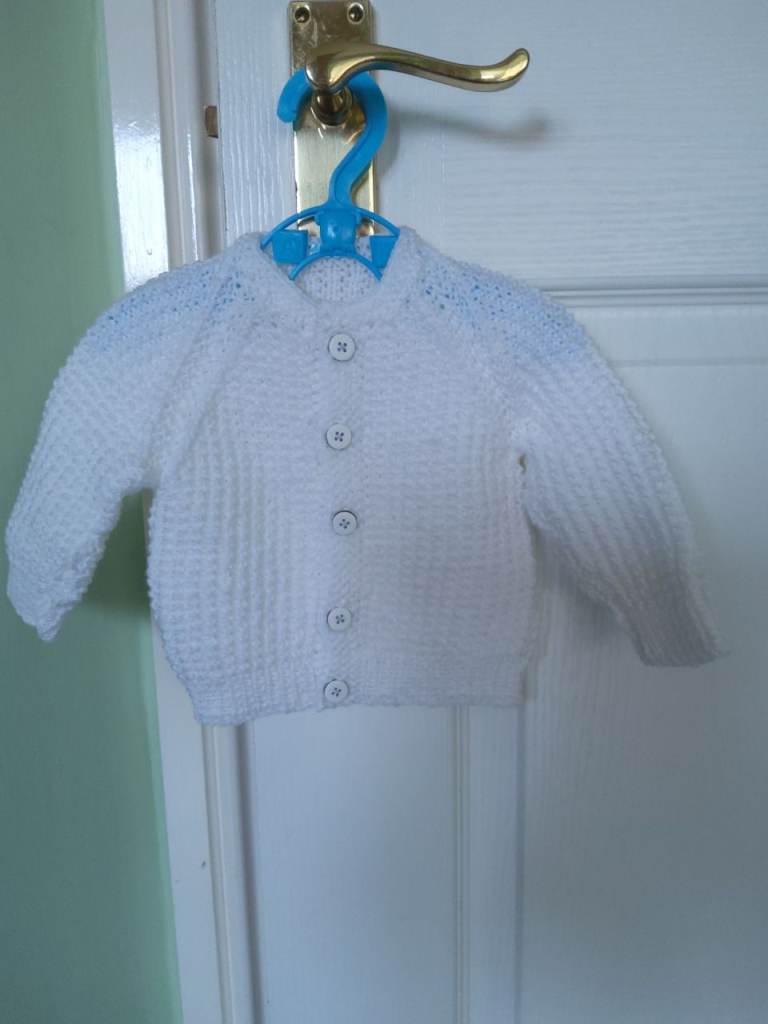 New, hand knitted baby cardigan 