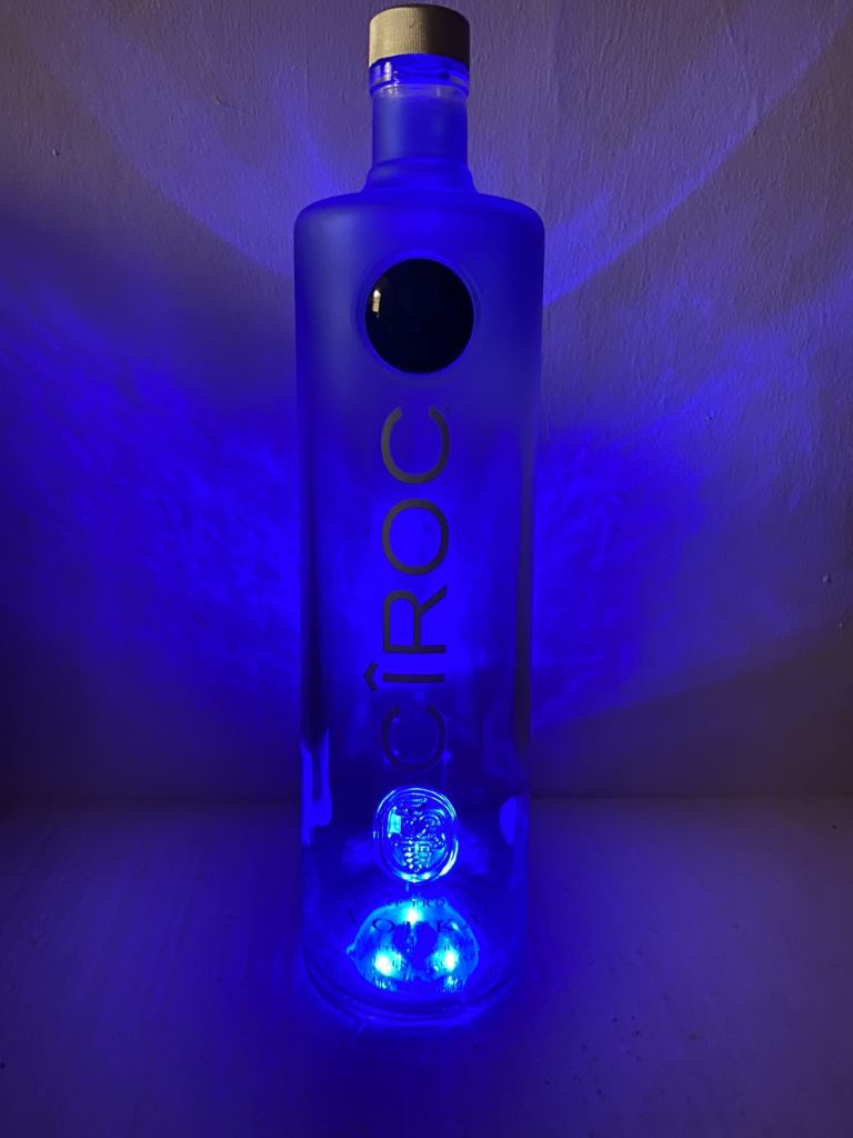 Light up Ciroc vodka glass bottle with blue lights . 