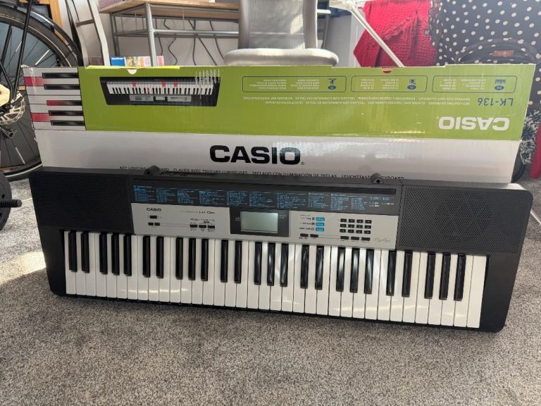 Casio LK-136 Electric Keyboard with Stand – Good Condition