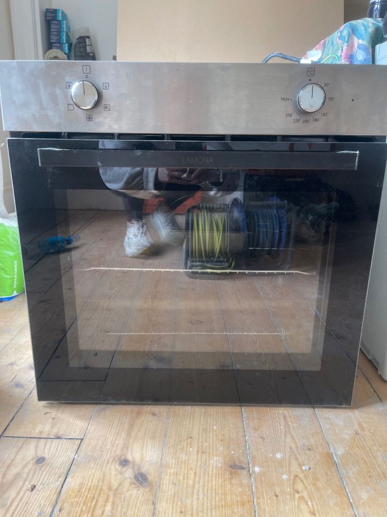 Integrated Electric Oven with Black Glass Door – New Condition