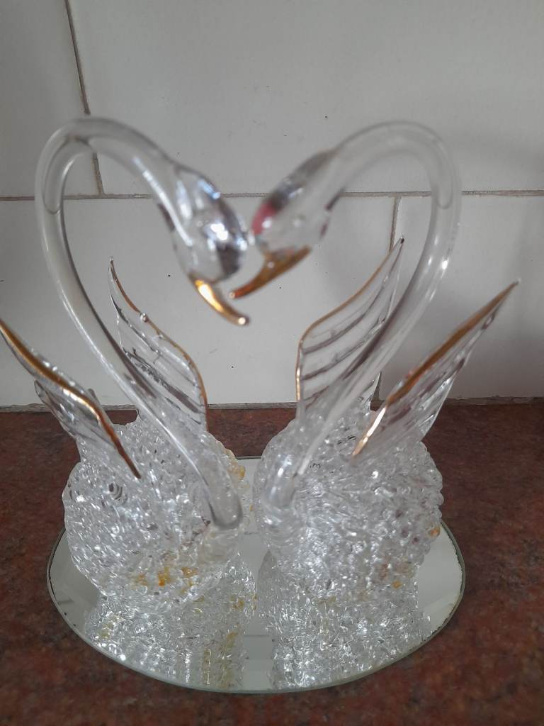 Handcrafted glass vintage loving swans.