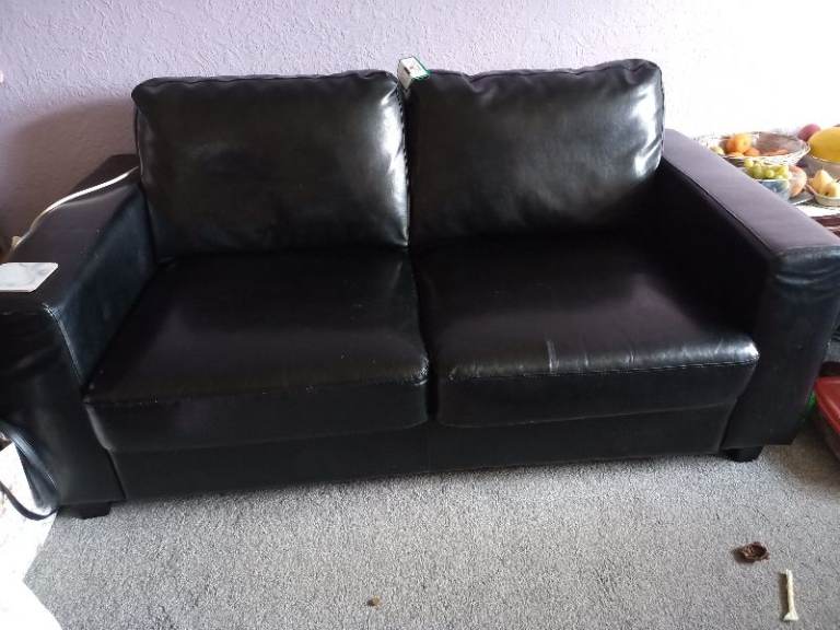 Two seater leather sofa bed 