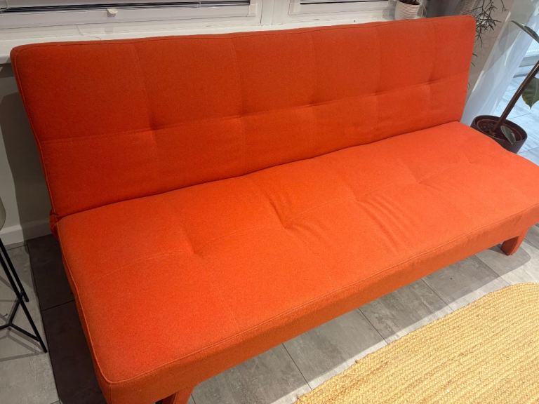 MADE click clack orange sofa bed 