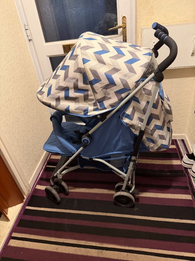 Blue Pushchair with Rain Cover – Good Condition