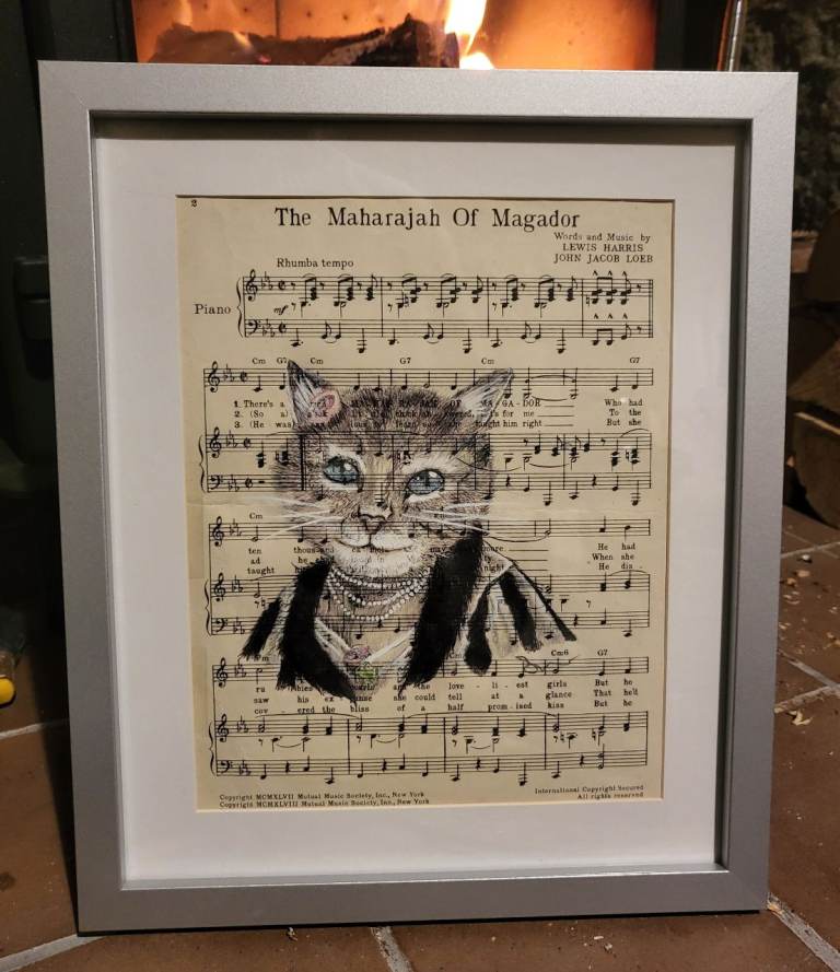 "The Maharajah Of Magador" featuring a cat illustration overlaid on a 1948 music sheet. 