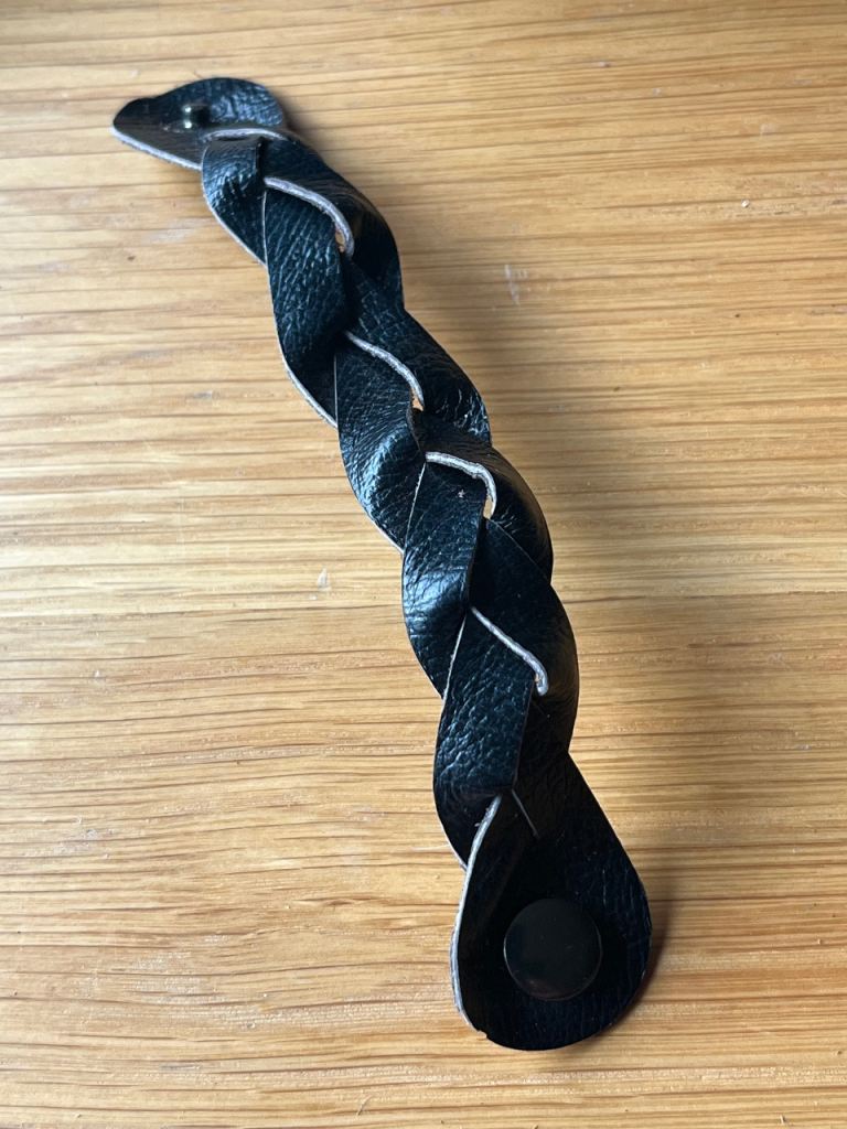 Dark blue leather plaited bracelet. Unisex. £1