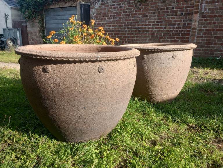 Two huge hand thrown garden pots