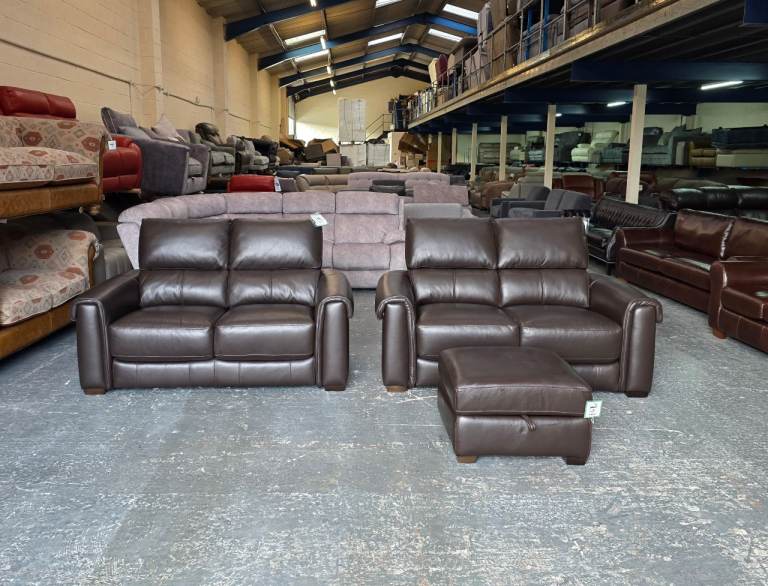 Ex-display Nixon dark browm leather pair of 2 seater sofas and footstool