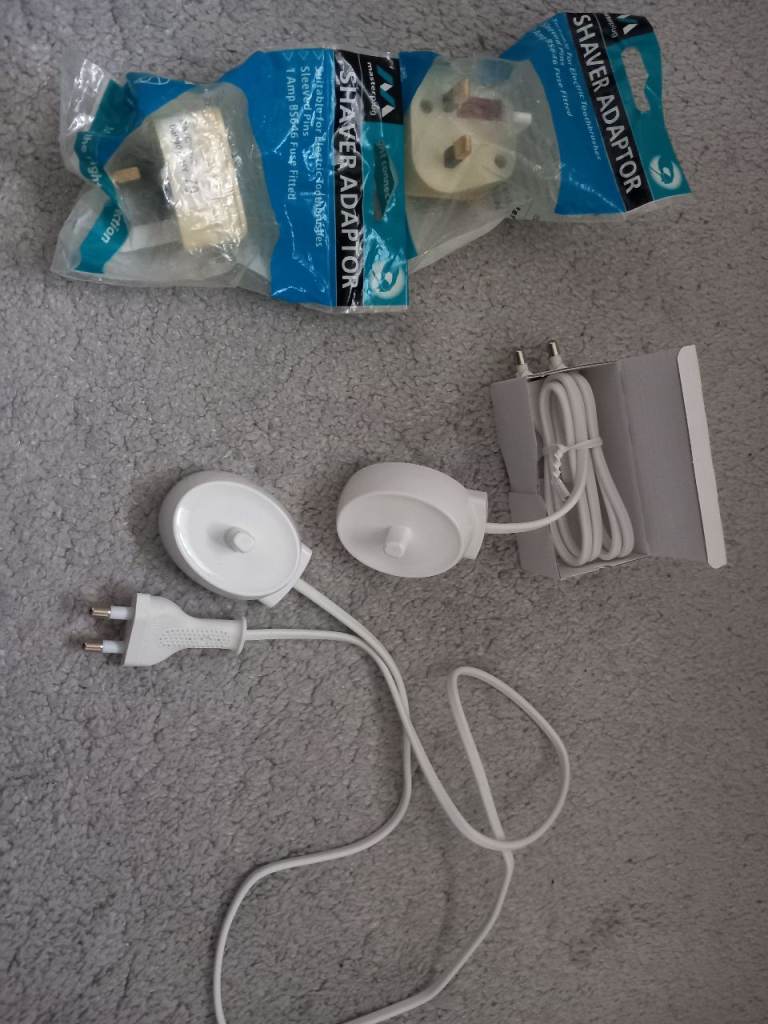 2 Electric toothbrush chargers and 2 adaptor plugs 