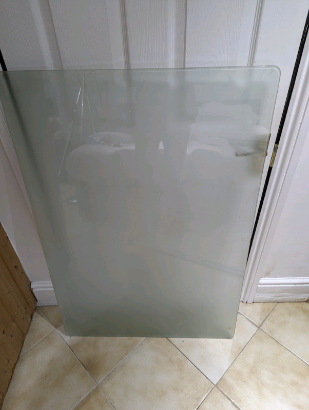 Glass top table with metal legs