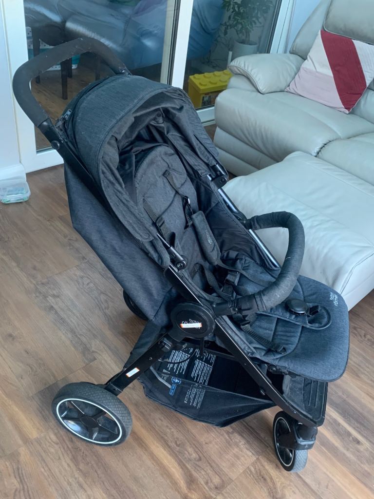 Britax Romer Black Pushchair with rain cover and foot muff.