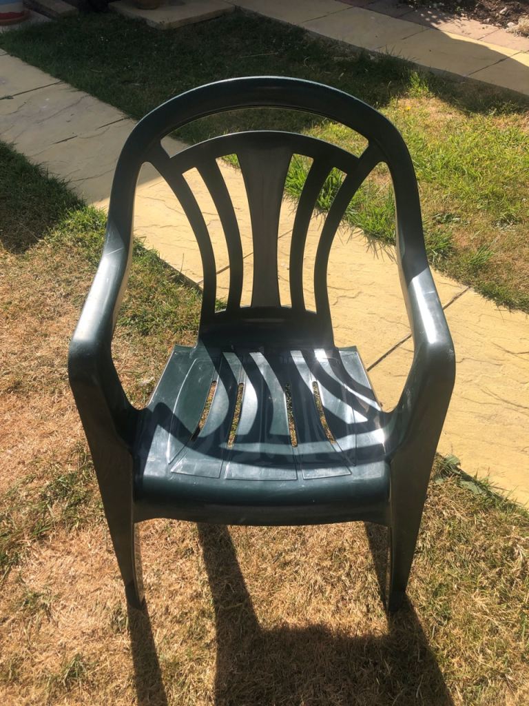 £4 each: dark green plastic stackable garden chair with arms USED