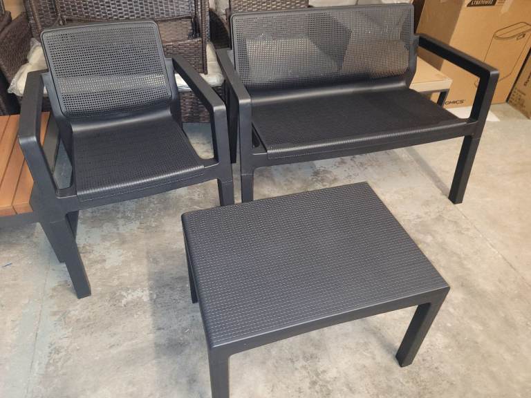 A new ( very slight seconds)  Keter plastic 3 seater garden furniture set with coffee table.