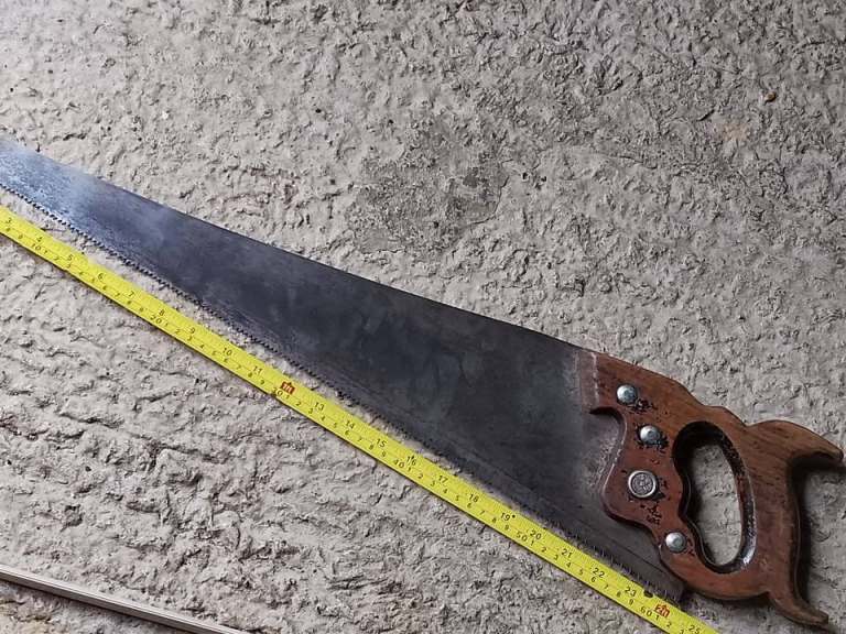 Vintage Warranted Superior Carpenters Saw is a 24-inch hand saw with a 8tpi