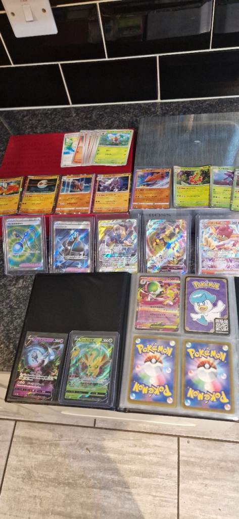 Large Collection of Pokémon Cards in Binders