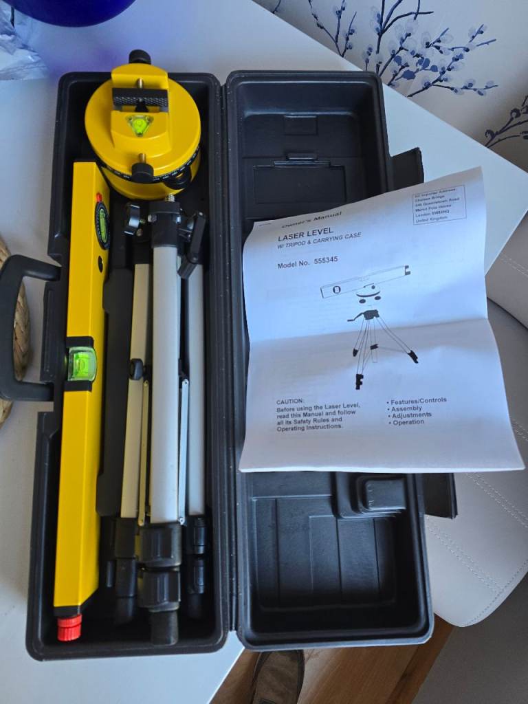 Laser level, tripod and carrying case