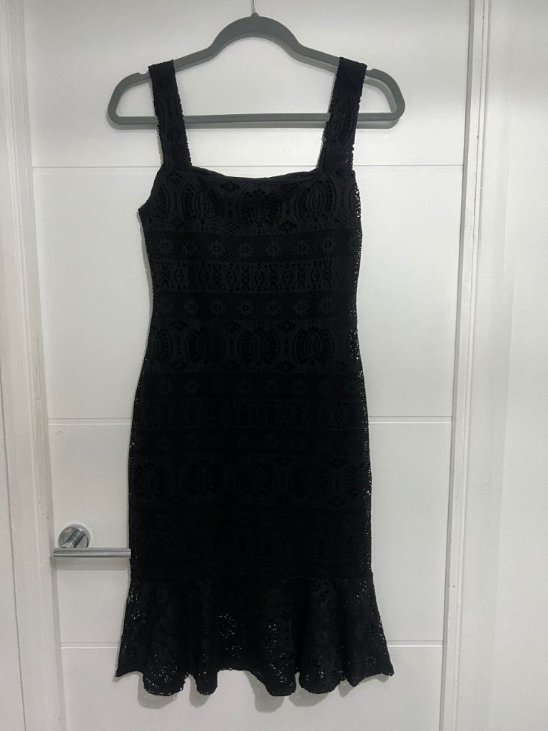 Elegant figure hugging black party/evening dress