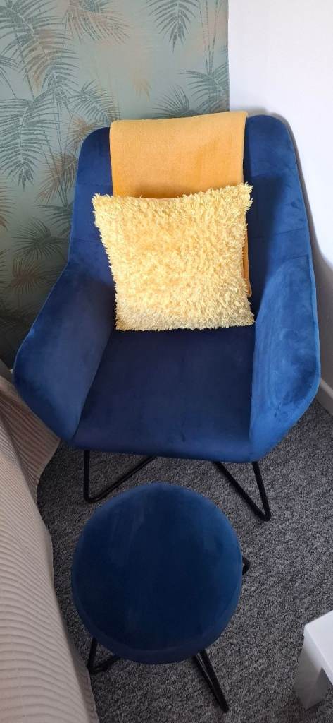 Blue velvet chair and foot stool