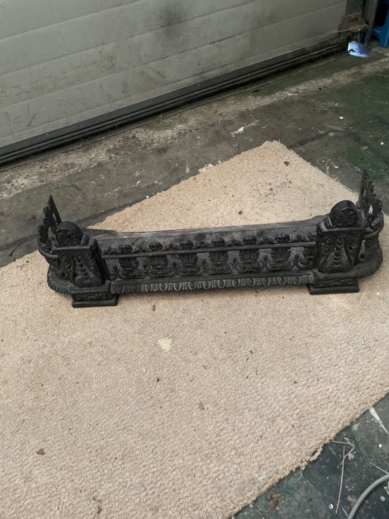 Victorian cast iron fireplace fender.