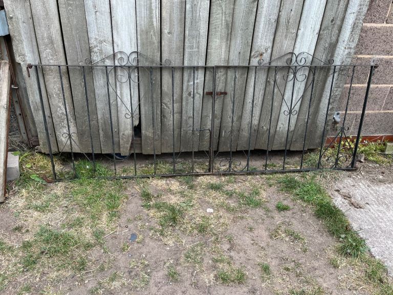 Pair of black metal driveway gates