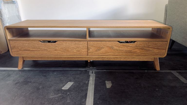 TV stand with 2 drawers. Oak veneer in good condition.   L 140cm H45cm D40cm   Levenshulme. 