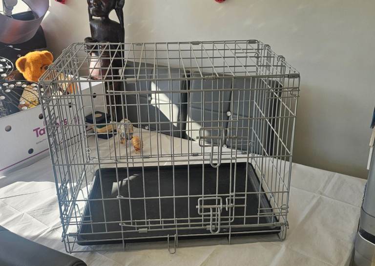 Almost new folding dog cage with tray 