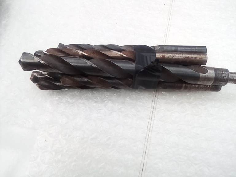 Bundle of larger size drill bits.