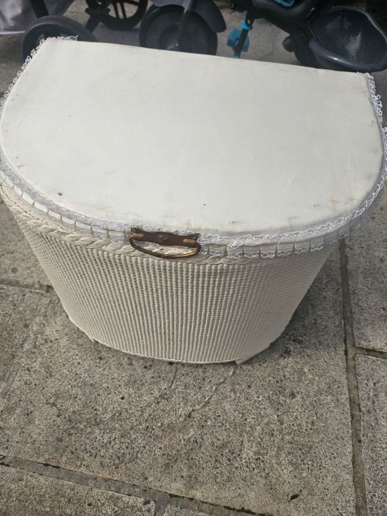 vintage white-painted Lloyd Loom style corner laundry and linen basket