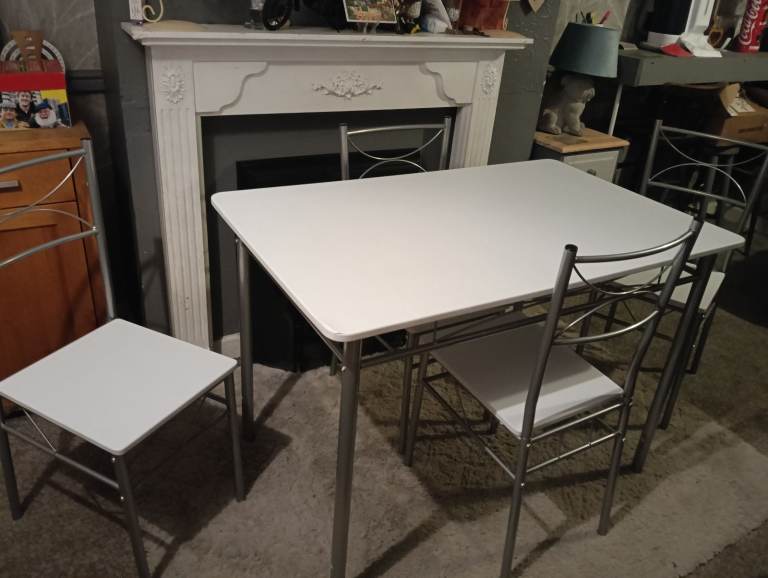 White dining table and four chairs feel free to contact me 
