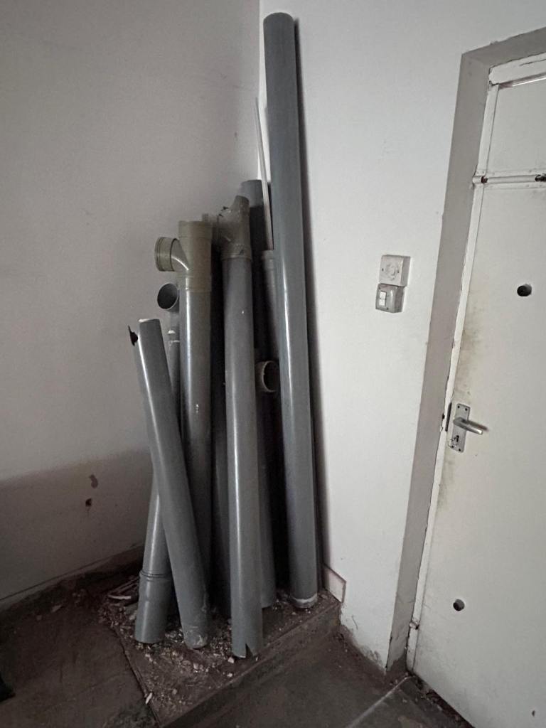 Assorted Grey Plastic Plumbing Pipes and Fittings