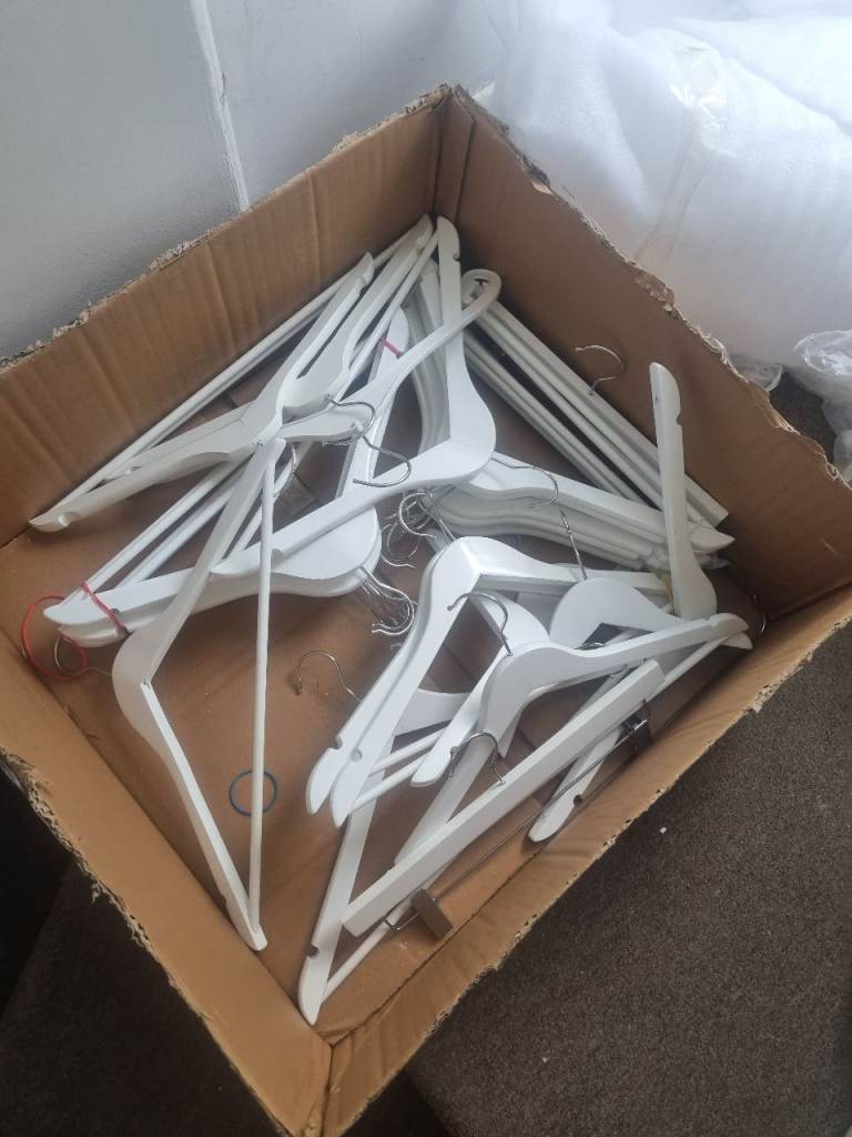 Mixed Lot of Clothes Hangers – White, Black, and Wood