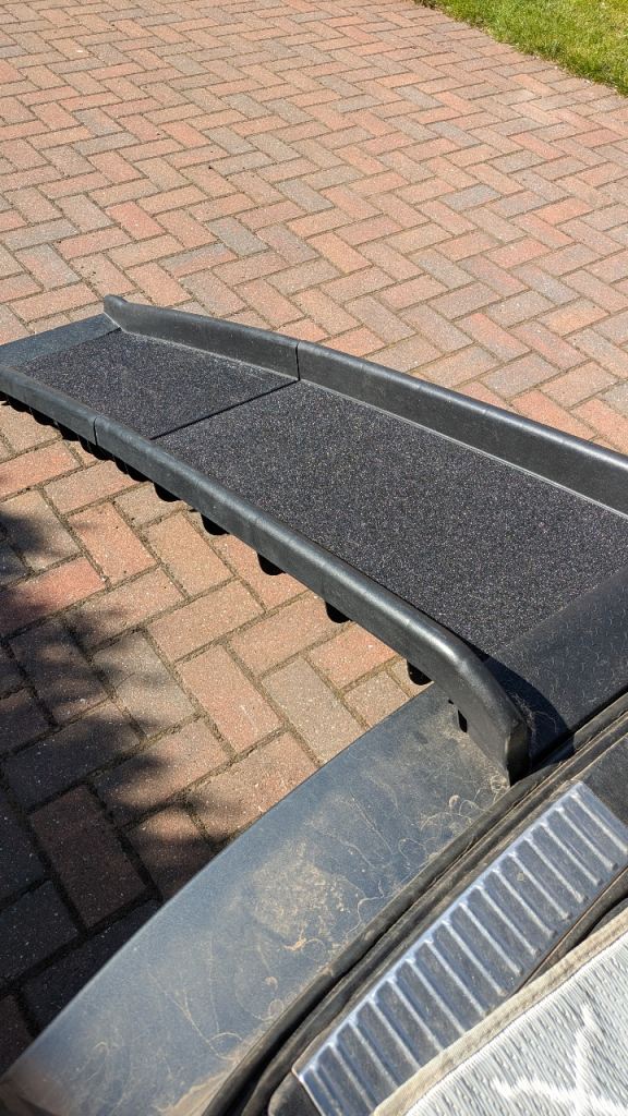 Folding heavy duty dog ramp with non slip surface.