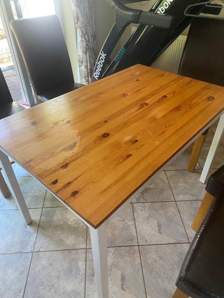 FREE - Solid wood dining table with 8 high-back faux leather dining chairs.