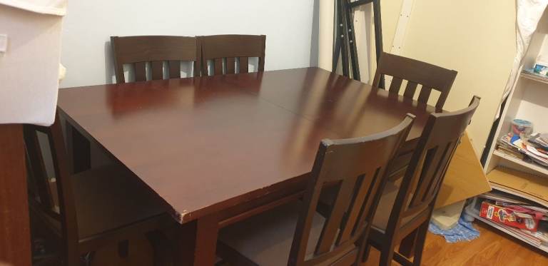 Dark wood extendable 6 seater dining table and chairs 